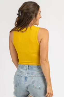 LE LIS ROUND NECK SLEEVELESS BODYSUIT IN GOLD CLOTHING